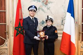 telechargement-38 "بطل الصمود اليومي".. سفارة المغرب بباريس تحتفي بالطفل نزار وتحقق حلمه بزي الأمن الوطني